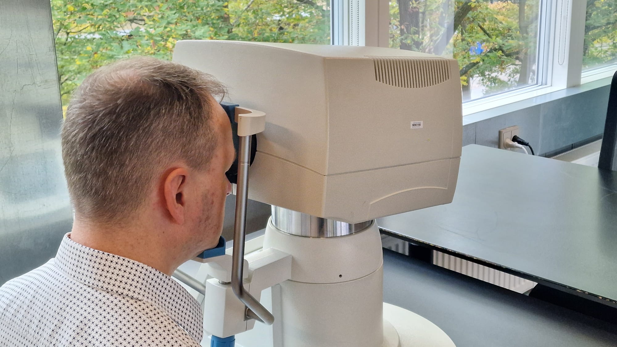 Patient using eye machine